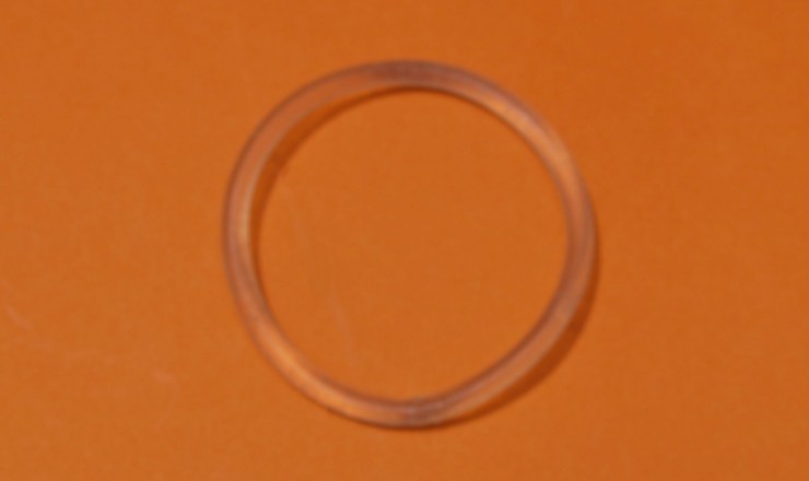 A photo of the nuvaring on an orange background.